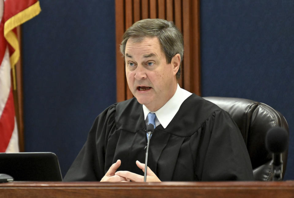 Floyd County Superior Court Judge Jack Niedrach speaks during a bond hearing at Floyd County Superior Court in Rome, Ga., on Friday, Feb. 14, 2020. Bond was denied Friday for the two Georgia men, 19-year-old Jacob Kaderli of Dacula and 25-year-old Michael Helterbrand of Dalton, authorities say are linked to a violent white supremacist group known as The Base. The two men are charged, along with 22-year-old Luke Lane of Silver Creek, of conspiring to kill members of a militant anti-fascist group and participating in a criminal gang. (Hyosub Shin/Atlanta Journal-Constitution via AP)