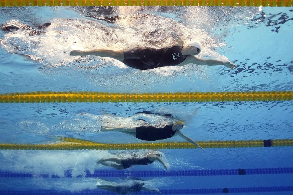 Katie Ledecky, top, of the United States, competes in a women's 1500-meter heat at the World Swimming Championships in Fukuoka, Japan, Monday, July 24, 2023. (AP Photo/David J. Phillip)