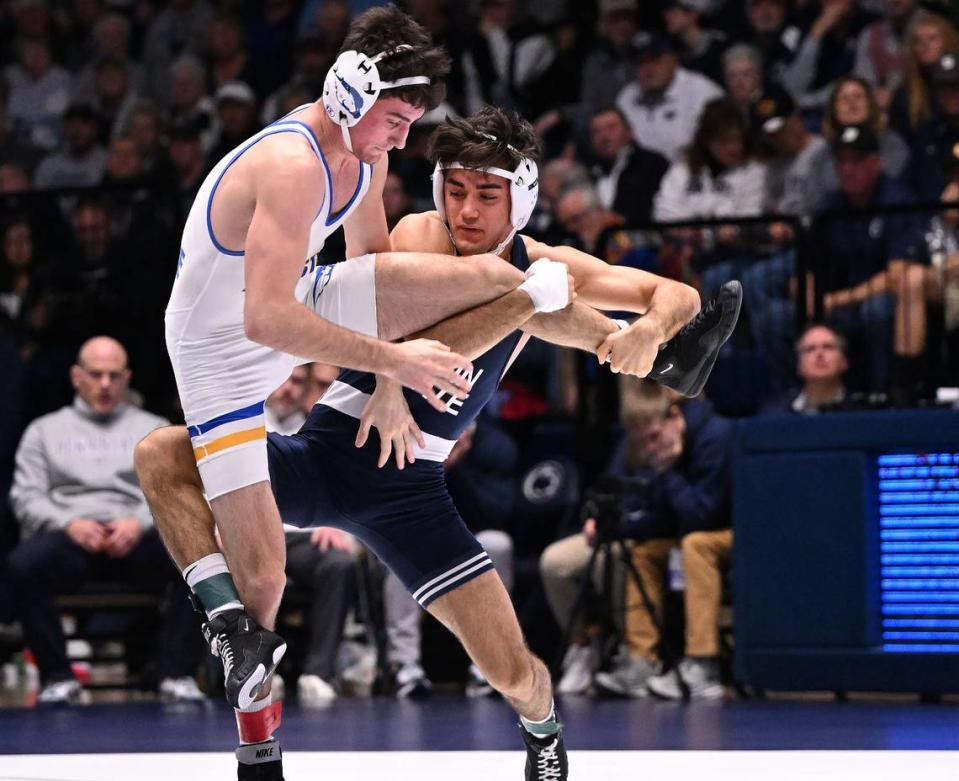 Penn State’s Aaron Nagao trips Hofstra’s Ryan Arbeit (133 lbs) for a takedown during Sunday’s match at Rec Hall at University Park. Nagao defeated Arbeit by tech fall, 21-6. Penn State defeated Hofstra, 43-10.