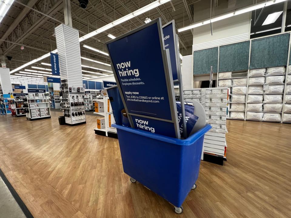 A bin full of outdated signage at a Bed Bath & Beyond store