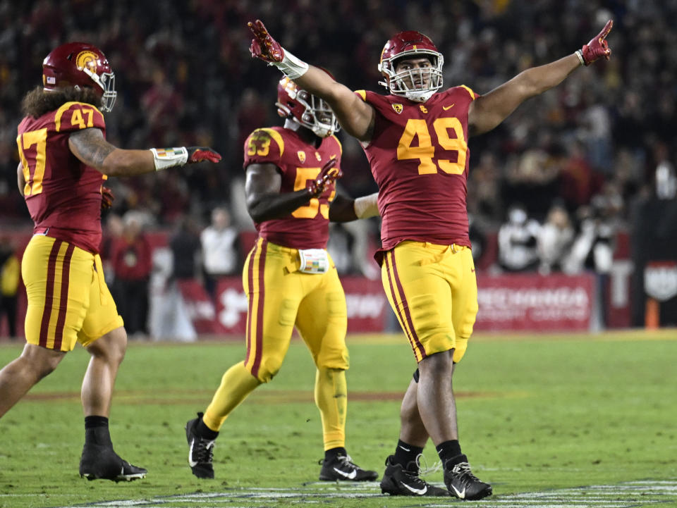 FILE - Southern California defensive lineman Tuli Tuipulotu celebrates a stop of California on fourth down during the first half of an NCAA college football game Saturday, Nov. 5, 2022, in Los Angeles. USC has created more turnovers and had more sacks in its first season with defensive coordinator Alex Grinch. (AP Photo/John McCoy)