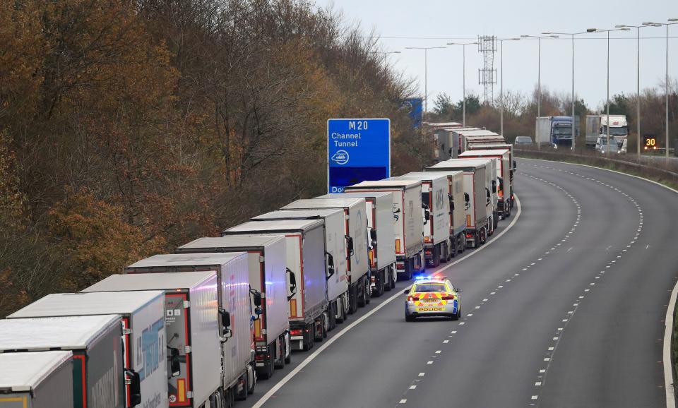 Freight lorries queueing along the M20 in Kent waiting to access the Eurotunnel terminal in Folkestone (PA)