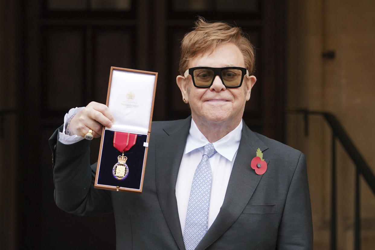 Sir Elton John after being made a member of the Order of the Companions of Honour for services to Music and to Charity during an investiture ceremony at Windsor Castle, in Windsor, England, Wednesday, Nov. 10, 2021. (Dominic Lipinski/Pool photo via AP)