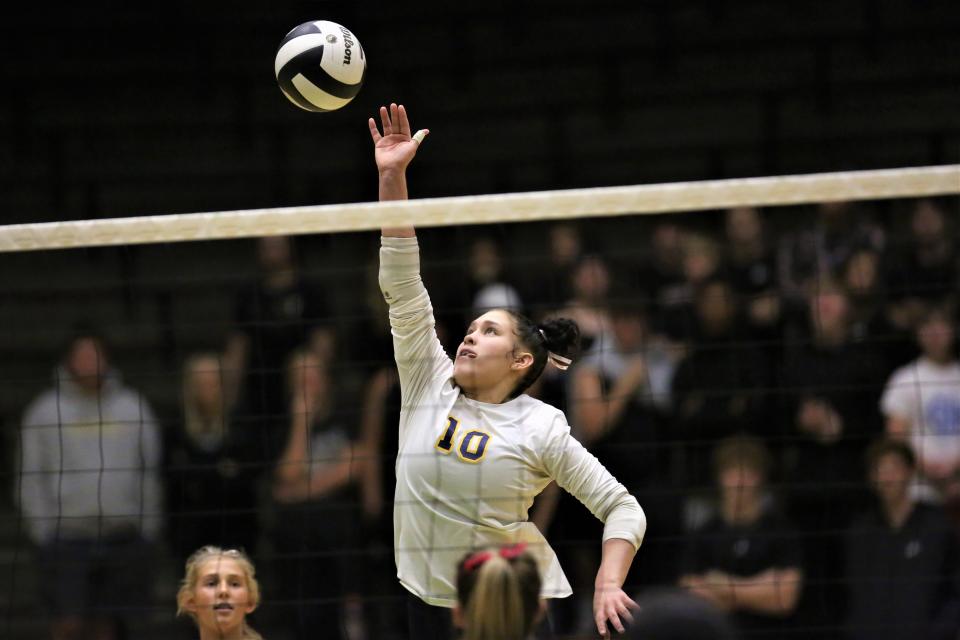 Delta volleyball's Camaya Murry skies for a kill in the team's sectional first round match against New Castle at New Castle High School on Thursday, Oct. 13, 2022.