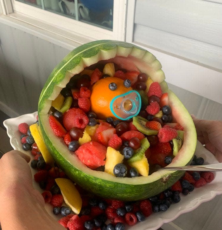 This watermelon cut to resemble a baby carriage was featured at a baby shower Gloria recently attended.