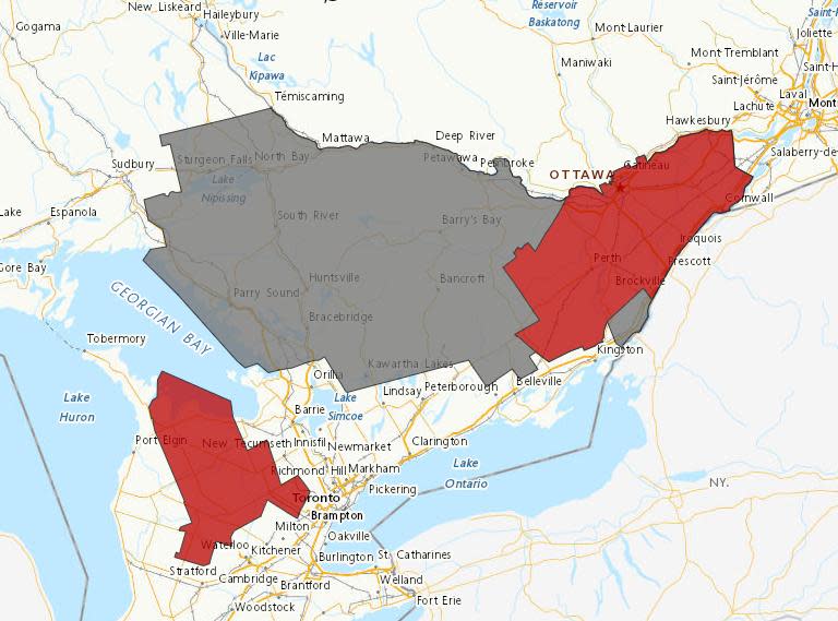 Environment Canada has freezing rain warnings, in red, and winter weather travel advisories, in grey, for almost all of eastern Ontario. as of 1 p.m.