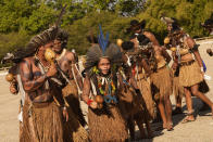 Indigenous people perform a ritual during the "Luta pela Vida," or Struggle for Life mobilization, a protest to pressure Supreme Court justices who are expected to issue a ruling that will have far-reaching implications for tribal land rights, outside the Supreme Court in Brasilia, Brazil, Wednesday, Aug. 25, 2021. (AP Photo/Eraldo Peres)