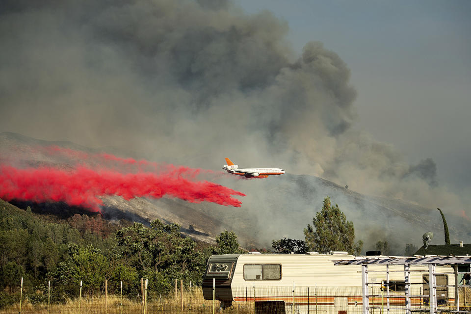 Wind-driven wildfires threatened homes in Northern California