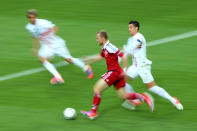 L'VIV, UKRAINE - JUNE 13: Lars Jacobsen of Denmark is put under pressure by Cristiano Ronaldo of Portugal during the UEFA EURO 2012 group B match between Denmark and Portugal at Arena Lviv on June 13, 2012 in L'viv, Ukraine. (Photo by Alex Livesey/Getty Images)