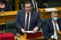 New Zealand Finance Minister Grant Robertson delivers his Budget speech to parliament in Wellington, New Zealand, Thursday, May 19, 2022. New Zealand's government said Thursday it will hand out an extra few hundred dollars to about half of all adults to help them navigate what it describes as "the peak of the global inflation storm." (Mark Mitchell/NZ Herald via AP)