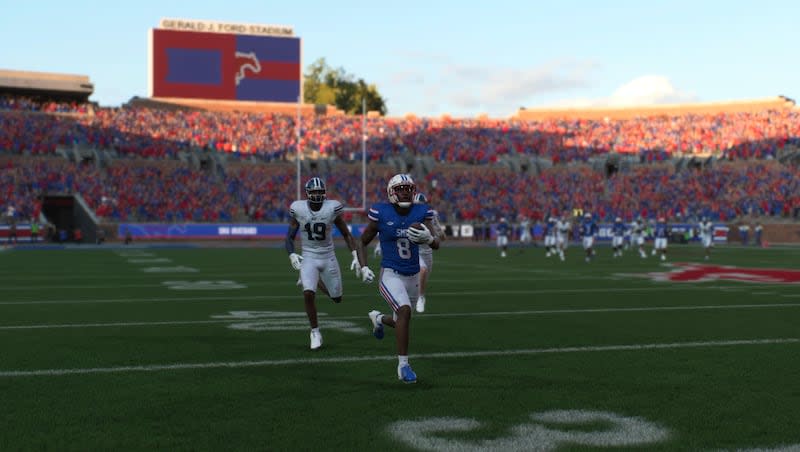 SMU wide receiver Jordan Hudson scores a touchdown on a 73-yard pass during a simulated game between BYU and SMU in the new EA Sports College Football 25 video game.