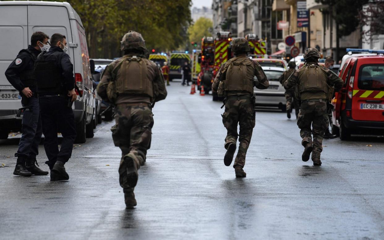 French soldiers descended on the site after two people were injured - ALAIN JOCARD /AFP