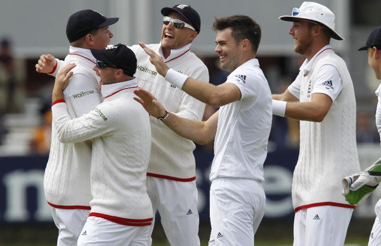 James Anderson (centre) celebrates taking the wicket of Martin Guptill on the fifth day of the first cricket Test match between England and New Zealand at Lord's on May 25, 2015