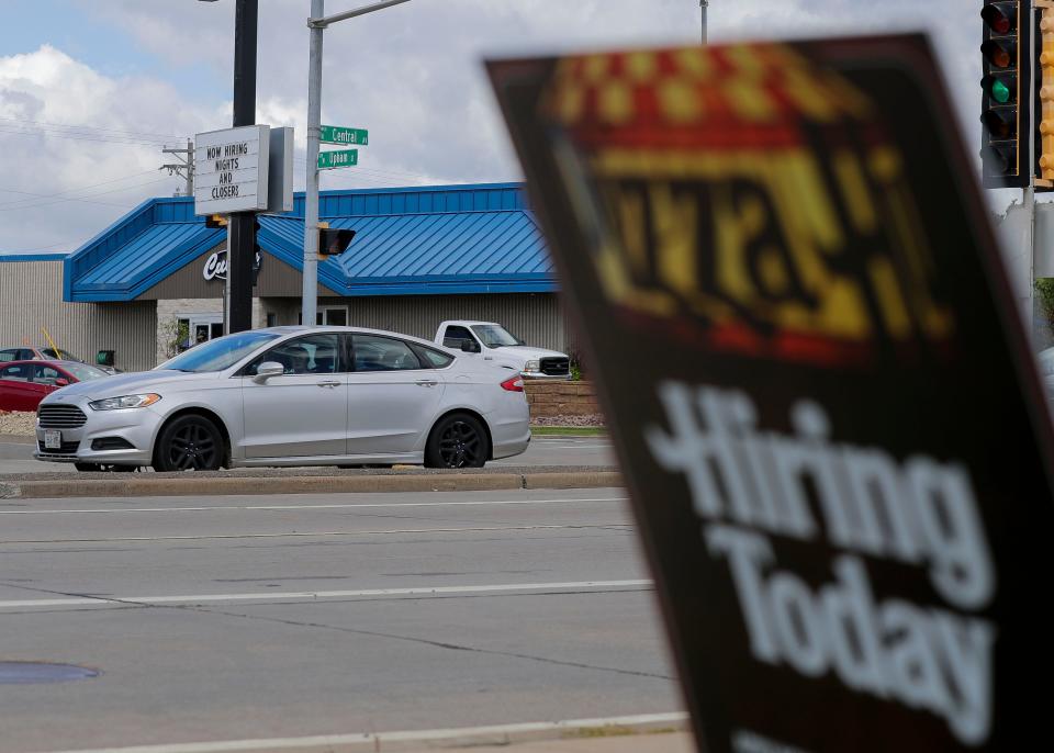 A sign advertising job openings is seen on Wednesday at Pizza Hut on Central Avenue in Marshfield.