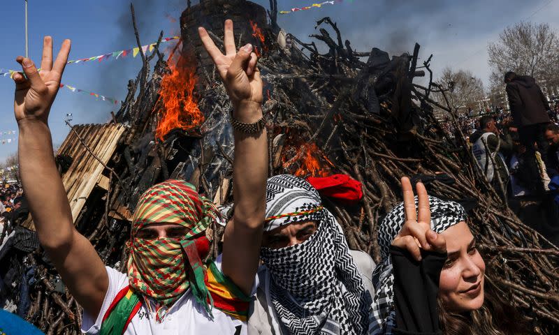 People gather to celebrate Newroz, which marks the arrival of spring and the new year, in Diyarbakir