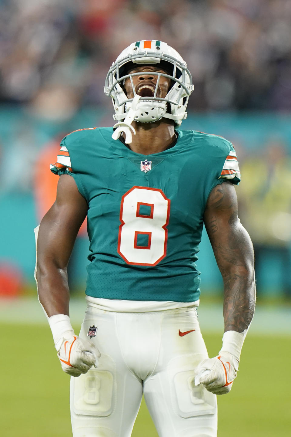 Miami Dolphins free safety Jevon Holland (8) celebrates after making a tackle during the second half of an NFL football game against the New England Patriots, Sunday, Jan. 9, 2022, in Miami Gardens, Fla. (AP Photo/Wilfredo Lee)