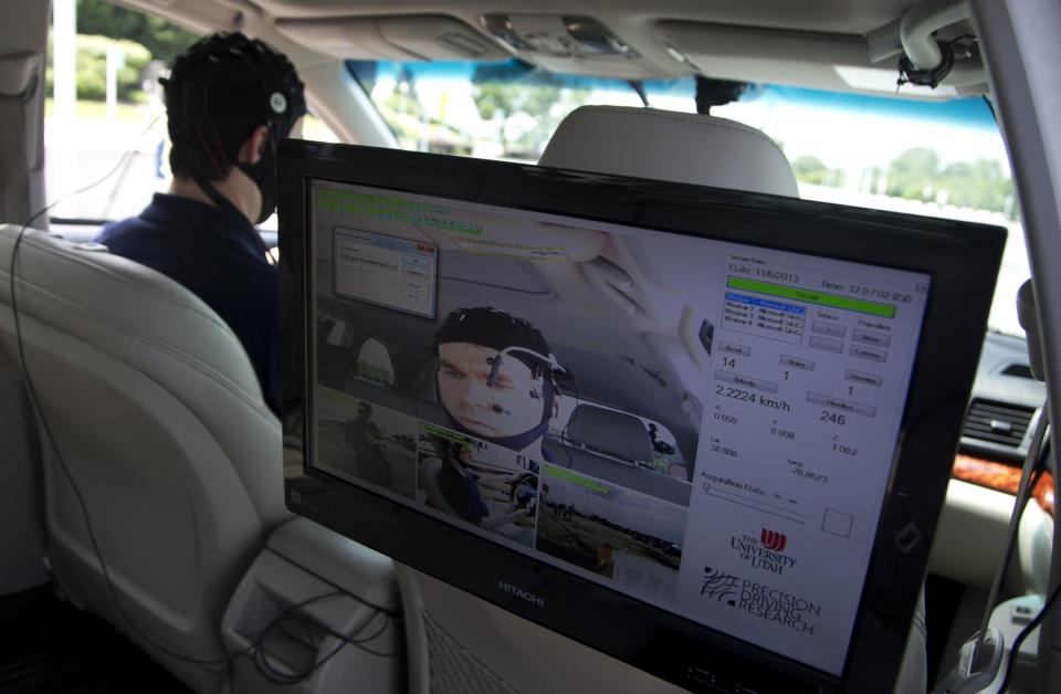 Russ Martin of American Automobile Association (AAA), is seen on a monitor in a research vehicle skull cap to the research vehicle during a demonstrations in support of their new study on distracted driving in Landover, Md., Tuesday, June 11, 2013. (AP Photo/Manuel Balce Ceneta)