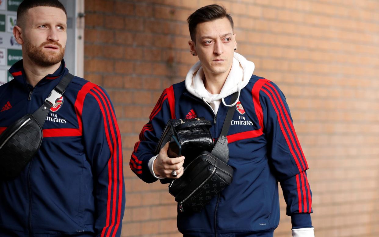 Mesut Ozil arrives for training - REUTERS