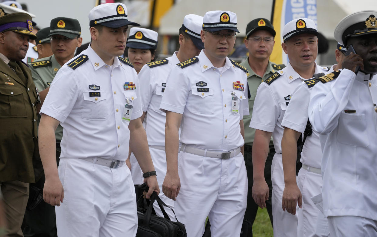 Chinese naval officers attend the Armed Forces Day in Richards Bay, South Africa, Tuesday, Feb. 21, 2023. The parade took place as a naval exercise was underway off the east coast of the country with Russian and Chinese navies.(Themba Hadebe)