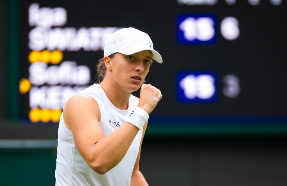 LONDON, ENGLAND - JULY 02: Iga Swiatek of Poland in action against Sofia Kenin of the United States in the first round on Day Two of The Championships Wimbledon 2024 at All England Lawn Tennis and Croquet Club on July 02, 2024 in London, England (Photo by Robert Prange/Getty Images)