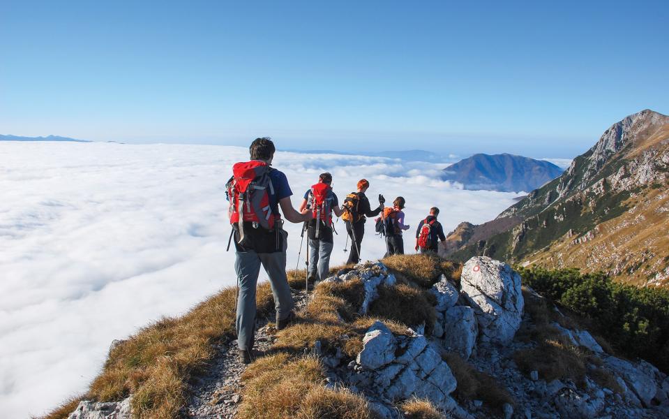 People hiking through snow in Slovenia