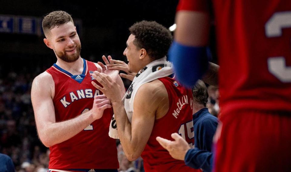 Kansas Jayhawks center Hunter Dickinson (1) celebrates with guard Kevin McCullar Jr. (15) during an NCAA college basketball game against the Kansas State Wildcats on Tuesday, March 5, 2024, in Lawrence.