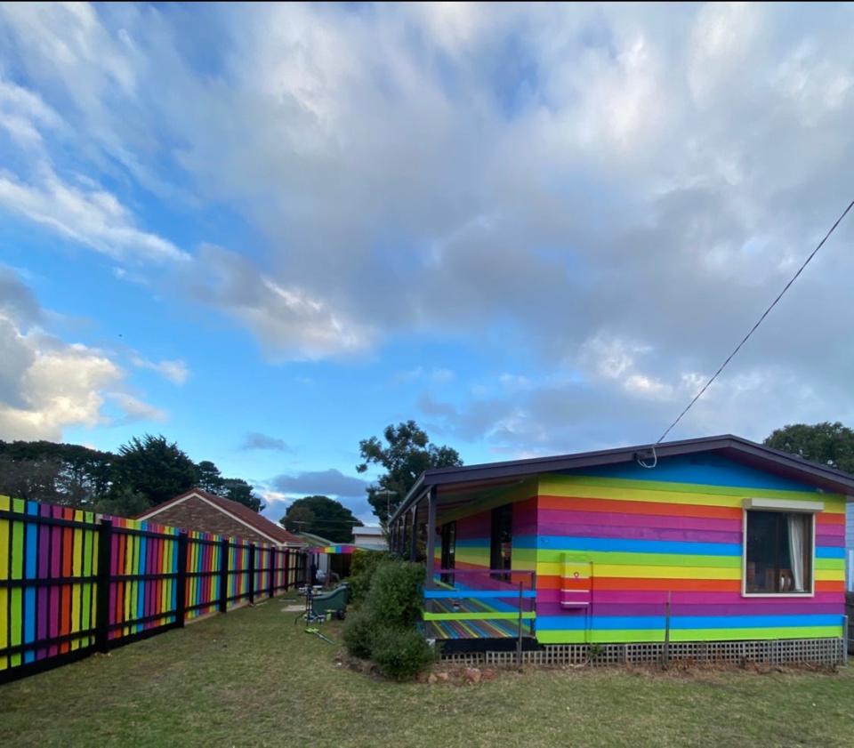 Mykey O'Halloran painted his beach home in Australia rainbow to the dismay of his neighbors.