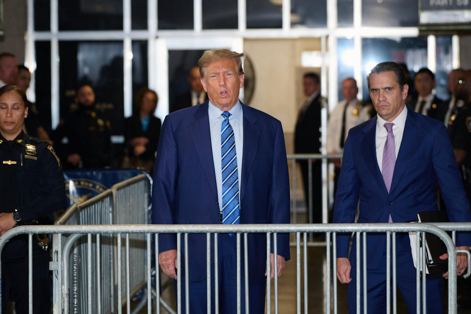 NEW YORK, NEW YORK - APRIL 16: Former U.S. President Donald Trump speaks to the media with attorney Todd Blanche before attending jury selection on the second day of his trial for allegedly covering up hush money payments at Manhattan Criminal Court on April 16, 2024 in New York City. Trump was charged with 34 counts of falsifying business records last year, which prosecutors say was an effort to hide a potential sex scandal, both before and after the 2016 presidential election. Trump is first former U.S. president to face trial on criminal charges. (Photo by Curtis Means-Pool/Getty Images)