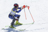 Greece's Aj Ginnis celebrates winning the silver medal of the men's World Championship slalom, in Courchevel, France, Sunday Feb. 19, 2023. (AP Photo/Alessandro Trovati)