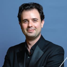 Benjamin Firer is serving as interim conductor for the QC Youth Symphony Orchestra and Youth Philharmonic for the 2023-2024 season.