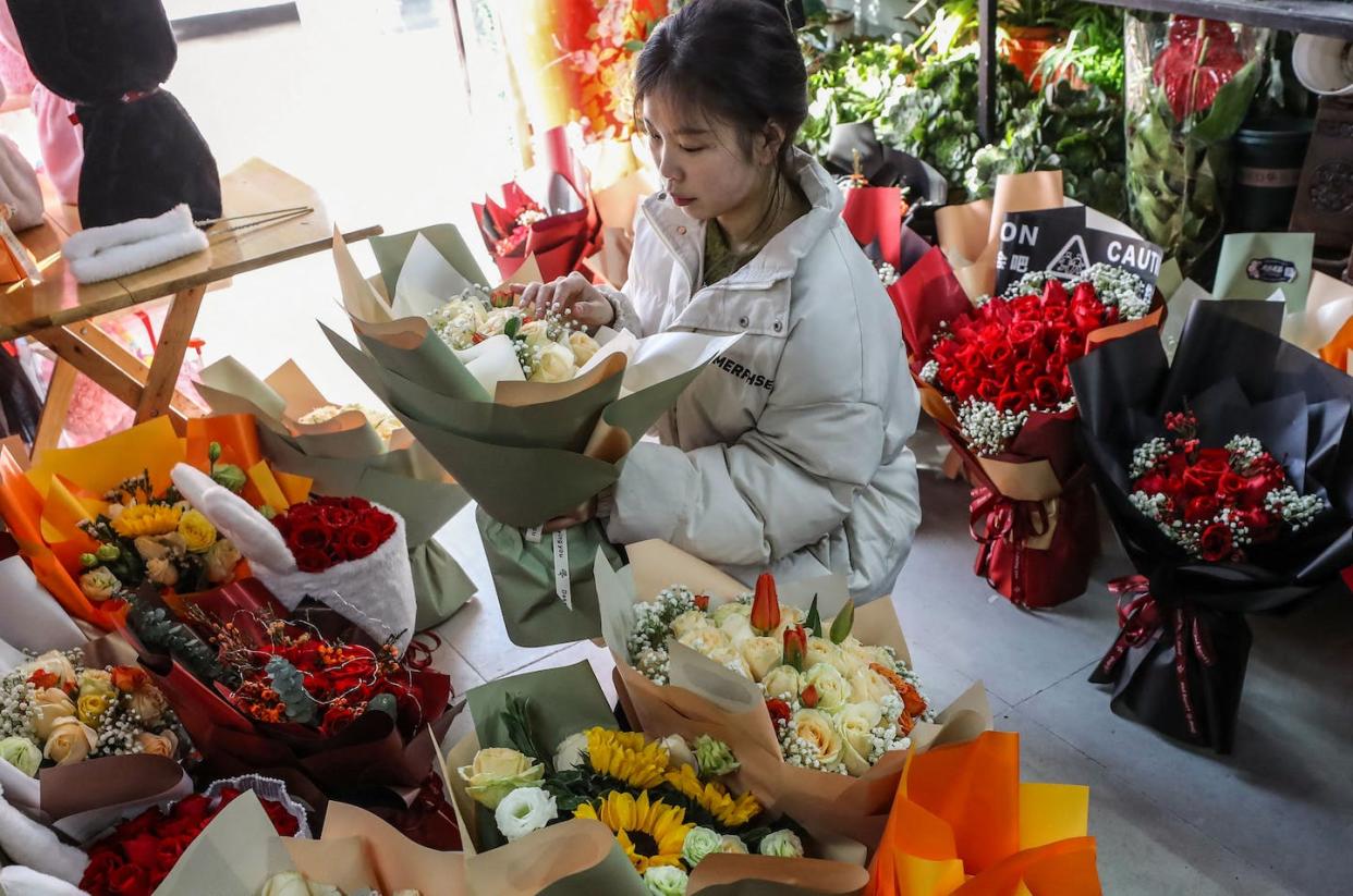 Looking for love − a store in Huaian, in China's eastern Jiangsu province, selling flowers on Valentine's Day. <a href="https://www.gettyimages.com/detail/news-photo/vendor-prepares-flowers-for-sale-on-valentines-day-in-news-photo/1247125259?adppopup=true" rel="nofollow noopener" target="_blank" data-ylk="slk:STR/AFP via Getty Images;elm:context_link;itc:0;sec:content-canvas" class="link ">STR/AFP via Getty Images</a>