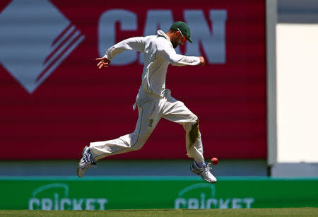 Cricket - Australia v Pakistan - Third Test cricket match - Sydney Cricket Ground, Sydney, Australia - 7/1/17 Australia's Nathan Lyon kicks the ball after it landed near him. REUTERS/David Gray