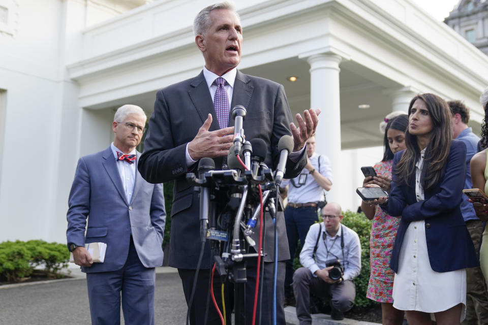 Speaker of the House Kevin McCarthy of Calif., talks to reporters as Rep. Patrick McHenry, R-N.C., listens after meeting with President Joe Biden at the White House, Monday, May 22, 2023, in Washington. (AP Photo/Evan Vucci)