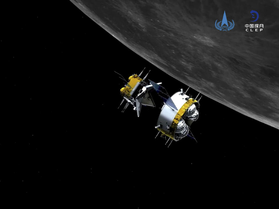 This graphic simulation image provided by China National Space Administration shows the orbiter and returner combination of China's Chang'e-5 probe after its separation from the ascender, at the Beijing Aerospace Control Center (BACC) in Beijing Sunday, Dec. 6, 2020. The Chinese probe that landed on the moon transferred rocks to an orbiter Sunday in preparation for returning samples of the lunar surface to Earth for the first time in almost 45 years, the country's space agency announced. (China National Space Administration/Xinhua via AP)