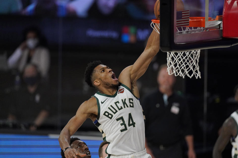 Ever wanted to see what Milwaukee Bucks' Giannis Antetokounmpo would look like playing football? Now you can. (AP Photo/Mark J. Terrill)