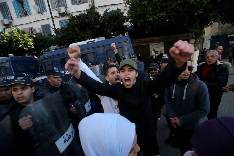 Demonstrators shout slogans during a protest calling to reject the upcoming presidential election in Algiers