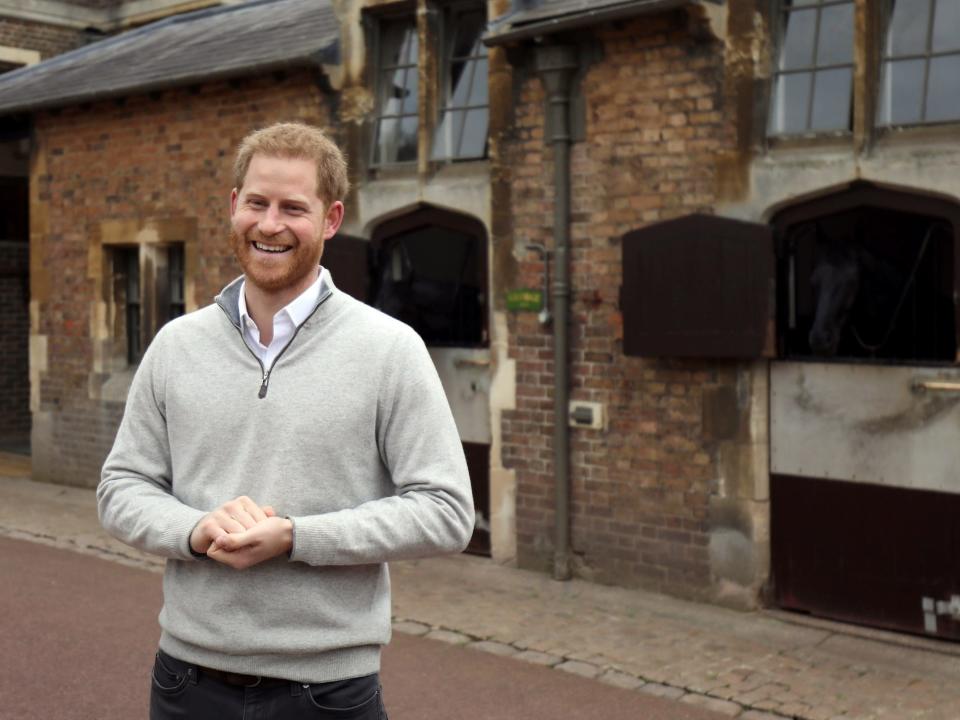 Prince Harry smiles in his first interview after the birth of his son.