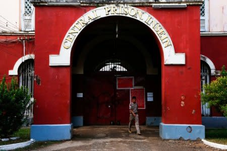 A security officer walks in front of Insein Prison in Yangon, Myanmar December 29, 2017. Picture taken December 29, 2017. REUTERS/Stringer