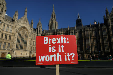 An anti-Brexit placard is fixed to traffic barriers opposite the Houses of Parliament in London, Britain, October 9, 2018. REUTERS/Simon Dawson