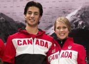 Ice dance couple Andrew Poje and Kaitlyn Weaver pose during the unveiling of the Canadian Olympic and Paralympic team clothing in Toronto, October 30, 2013. REUTERS/Mark Blinch (CANADA - Tags: SPORT OLYMPICS FIGURE SKATING)