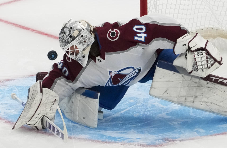 Colorado Avalanche goaltender Alexandar Georgiev (40) makes a stop against the Seattle Kraken during the first period of an NHL hockey game Tuesday, Oct. 17, 2023, in Seattle. (AP Photo/Lindsey Wasson)