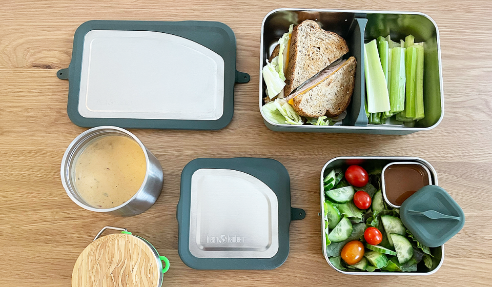 Klean Kanteen’s Rise Food Box Set, filled with a sandwich, celery and salad, paired with a canister of soup