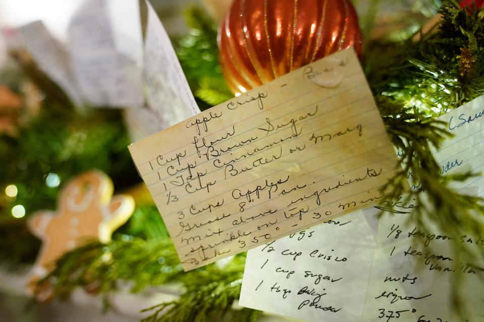 A copy of first lady Jill Biden's apple crisp recipe card decorates a fireplace mantel in the China Room of the White House.
