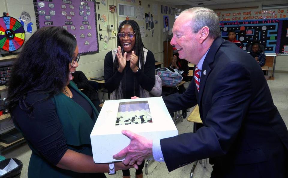 Tasha Morman, who teaches fifth-grade science and social studies at St. Marys Road Magnet Academy in Columbus, left, was notified in her classroom Friday morning by school superintendent David Lewis, right, that she is one of three finalists for Muscogee County School District 2023 Teacher of the Year. 04/14/2023