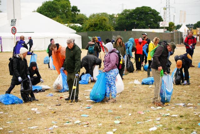 Litter pickers work to clear Worthy Farm