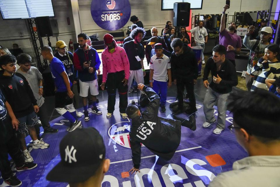 Dancers perform during a break in the Breaking for Gold Big Apple breakdancing regional competition Saturday, April 22, 2023, in the Brooklyn borough of New York. The hip-hop dance form makes its official debut at the Paris Games in 2024. (AP Photo/Frank Franklin II)