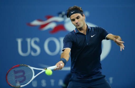Switzerland's Roger Federer returns a shot to American Donald Young during their US Open men's first round match on Monday. Federer beat Young 6-3, 6-2, 6-4