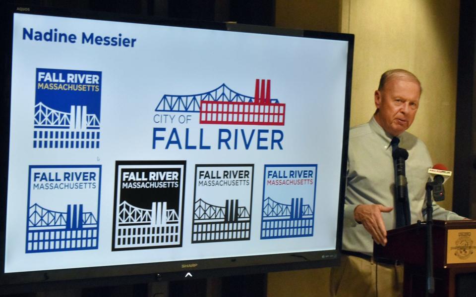 Mayor Paul Coogan unveils the new city logo during a ceremony Tuesday, Jan. 31, at Government Center.