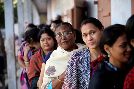 Hindu voters wait to cast their vote outside a voting center during the general election in Dhaka, Bangladesh December 30, 2018. REUTERS/Mohammad Ponir Hossain