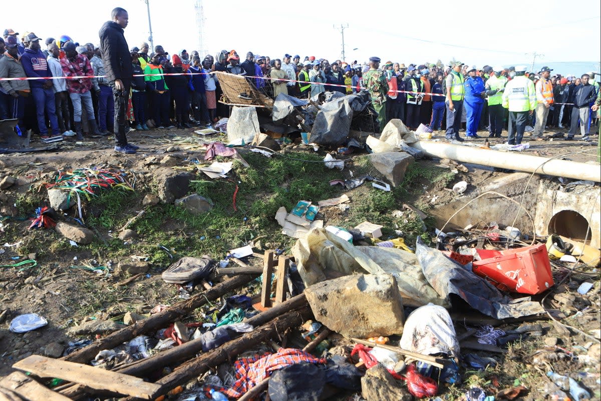 Residents gather at the scene of the accident  (REUTERS)